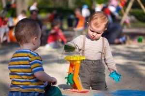 1414282-2-years-old-children-are-playing-together-in-the-sandbox